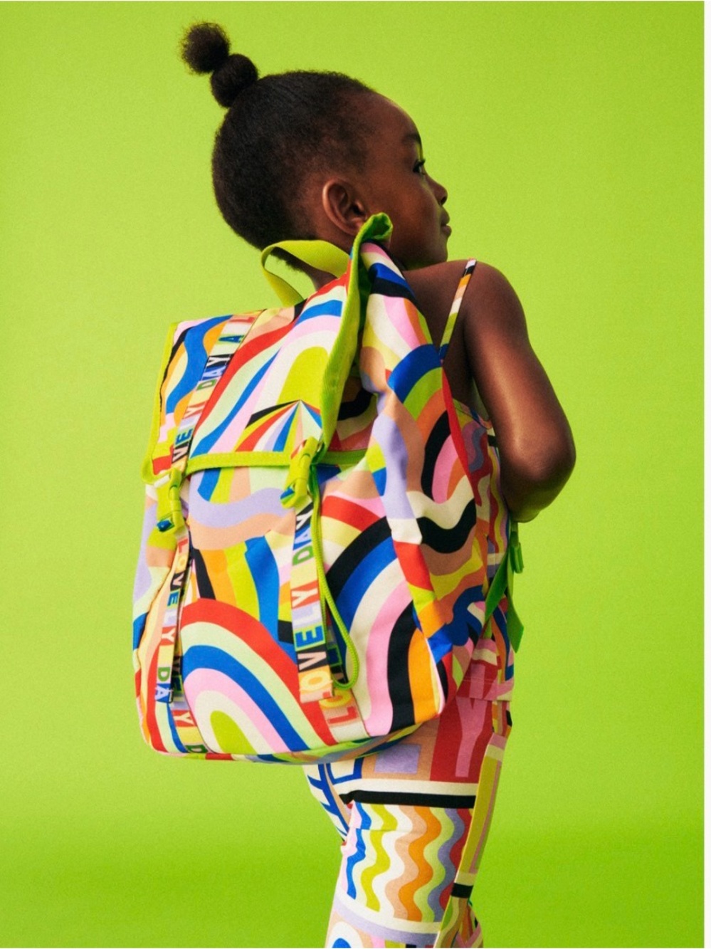 H&M Lakwena children's backpack featuring a vibrant, multicolored "Lovely Day"